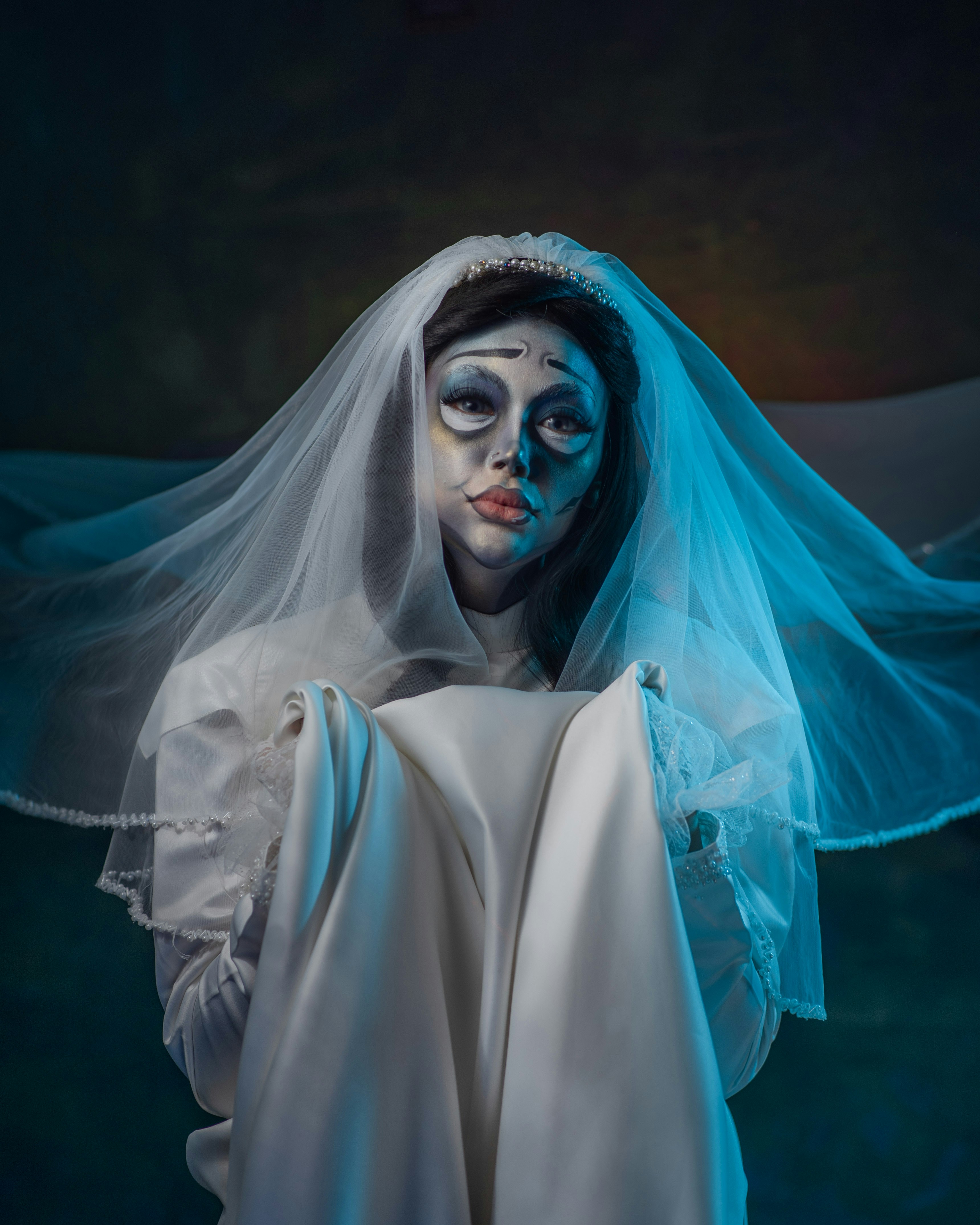 Zombie bride with tattered dress and scary makeup
