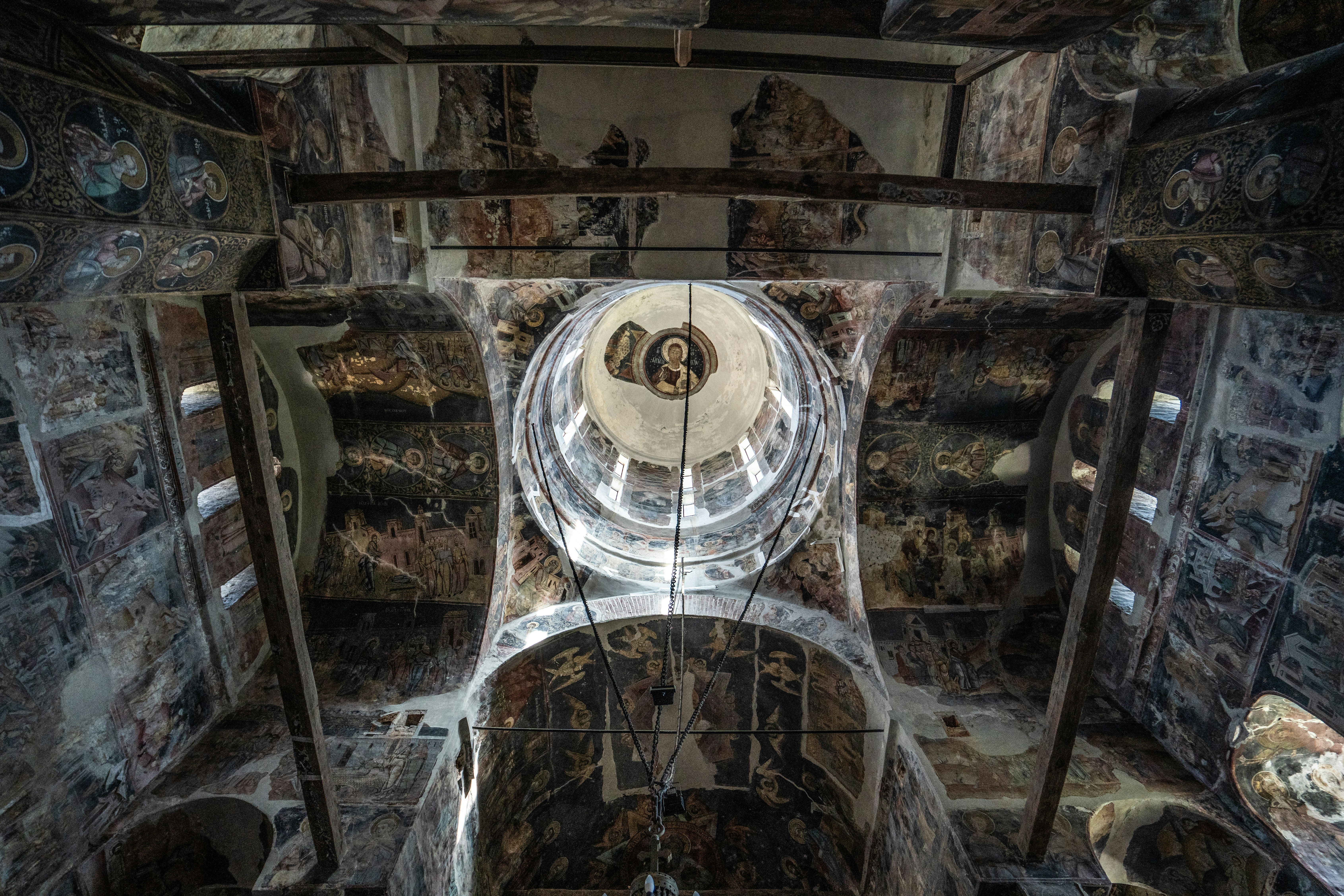 A very old looking room with a clock on the wall