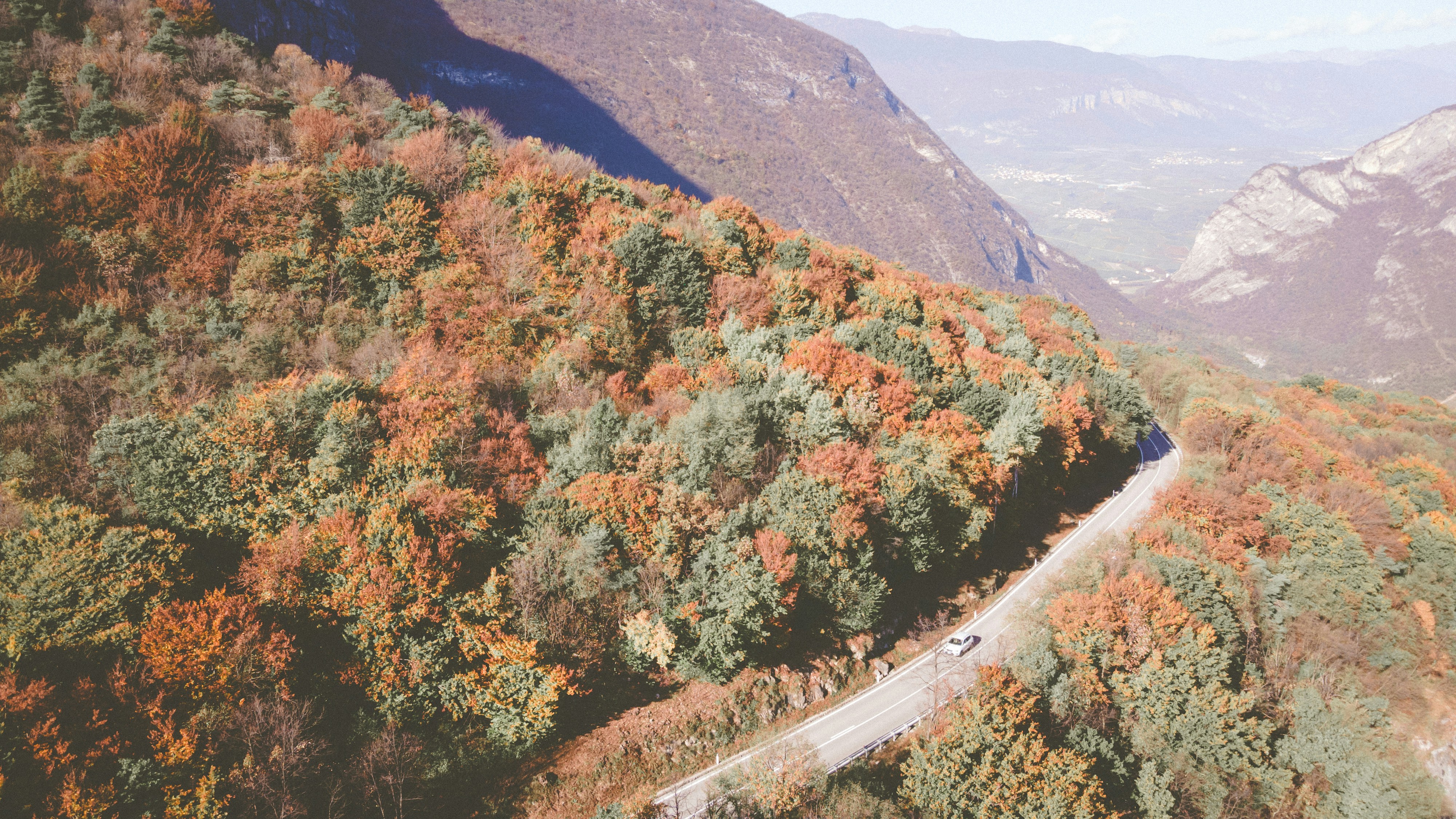 A scenic view of a winding road in the mountains