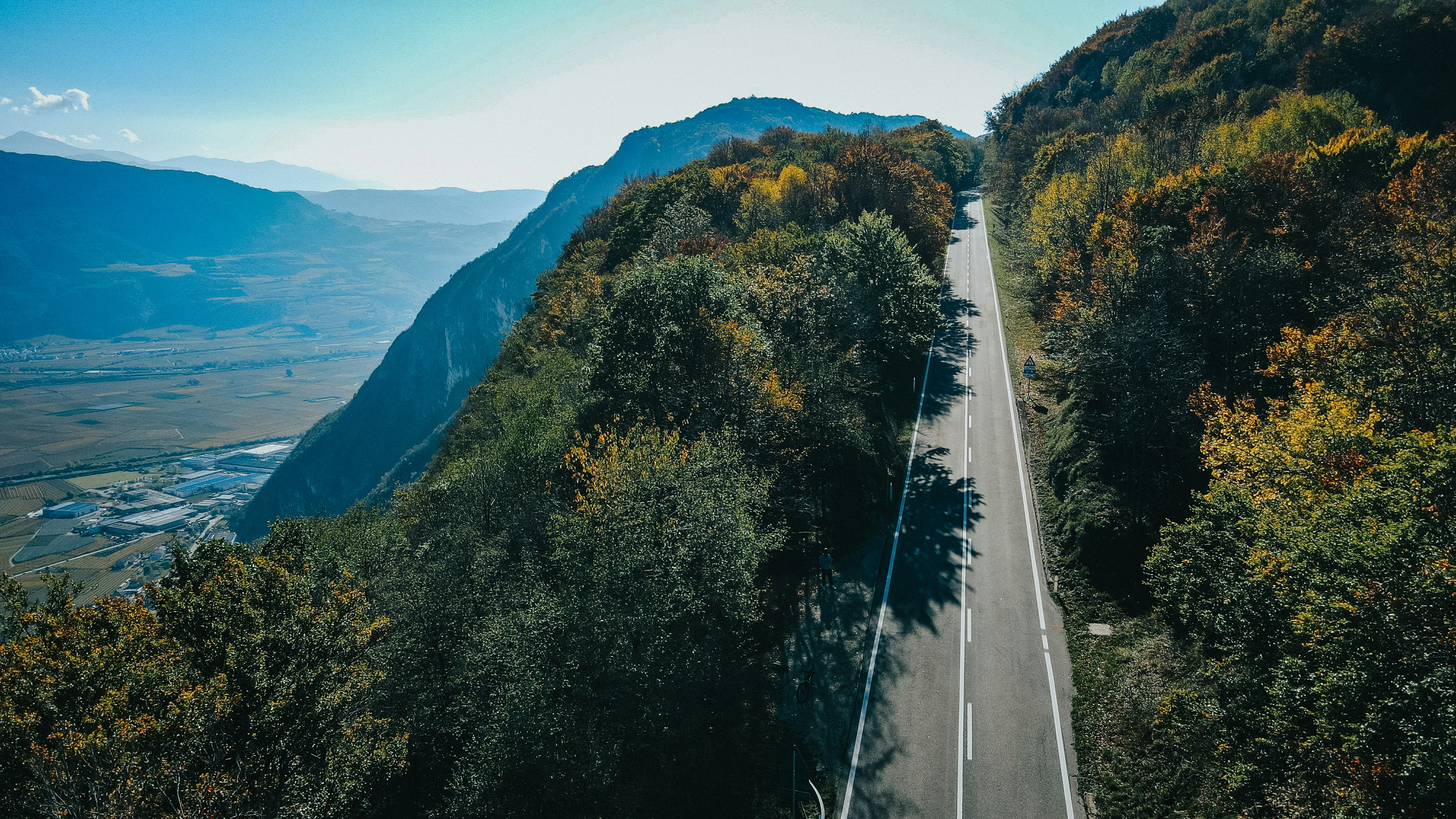 An aerial view of a road in the mountains
