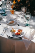 A table set with plates of food and silverware