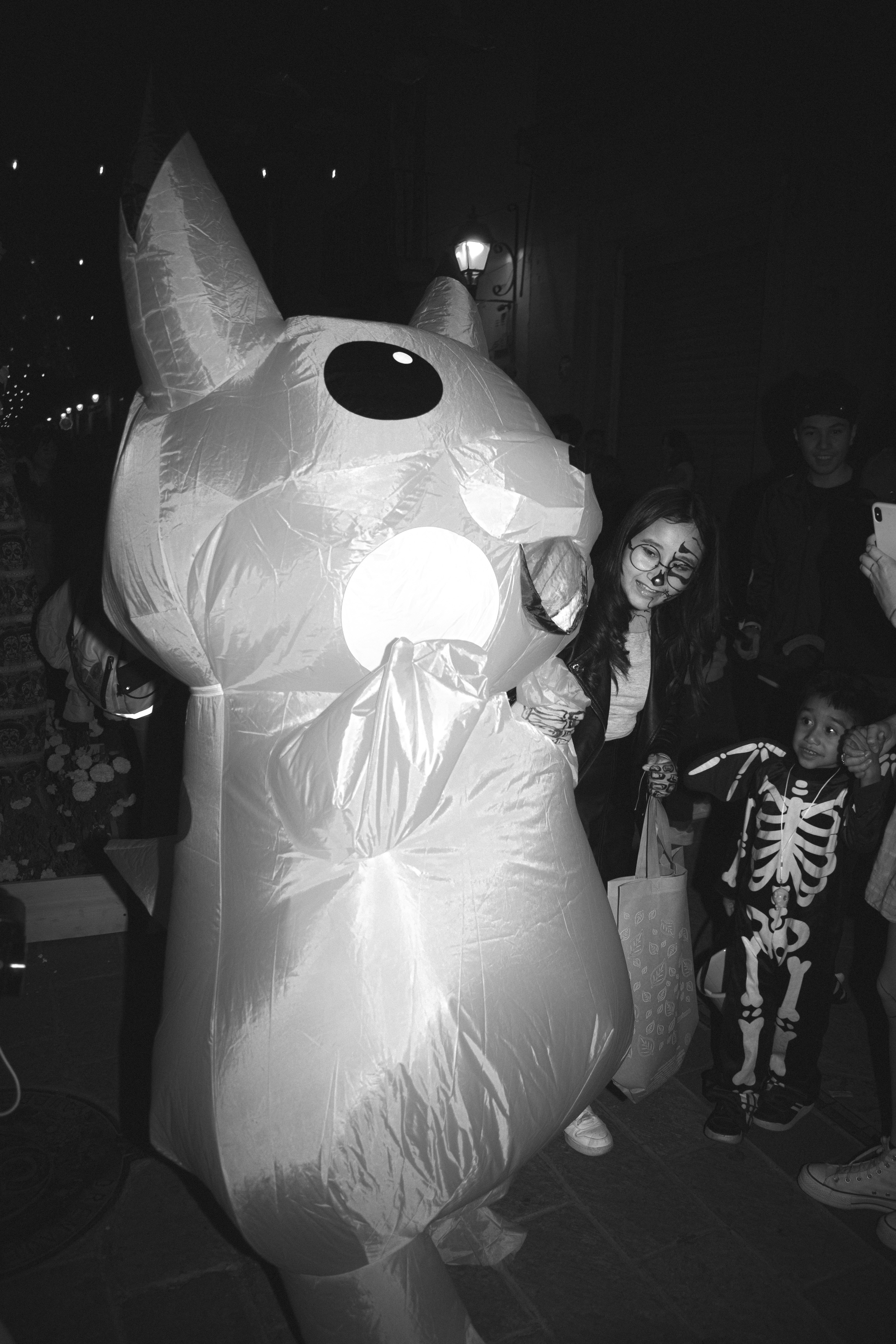 A group of people standing around in a room