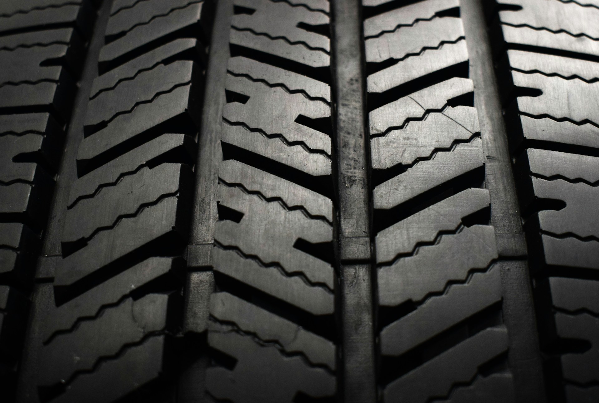 A close up of a tire on a black background