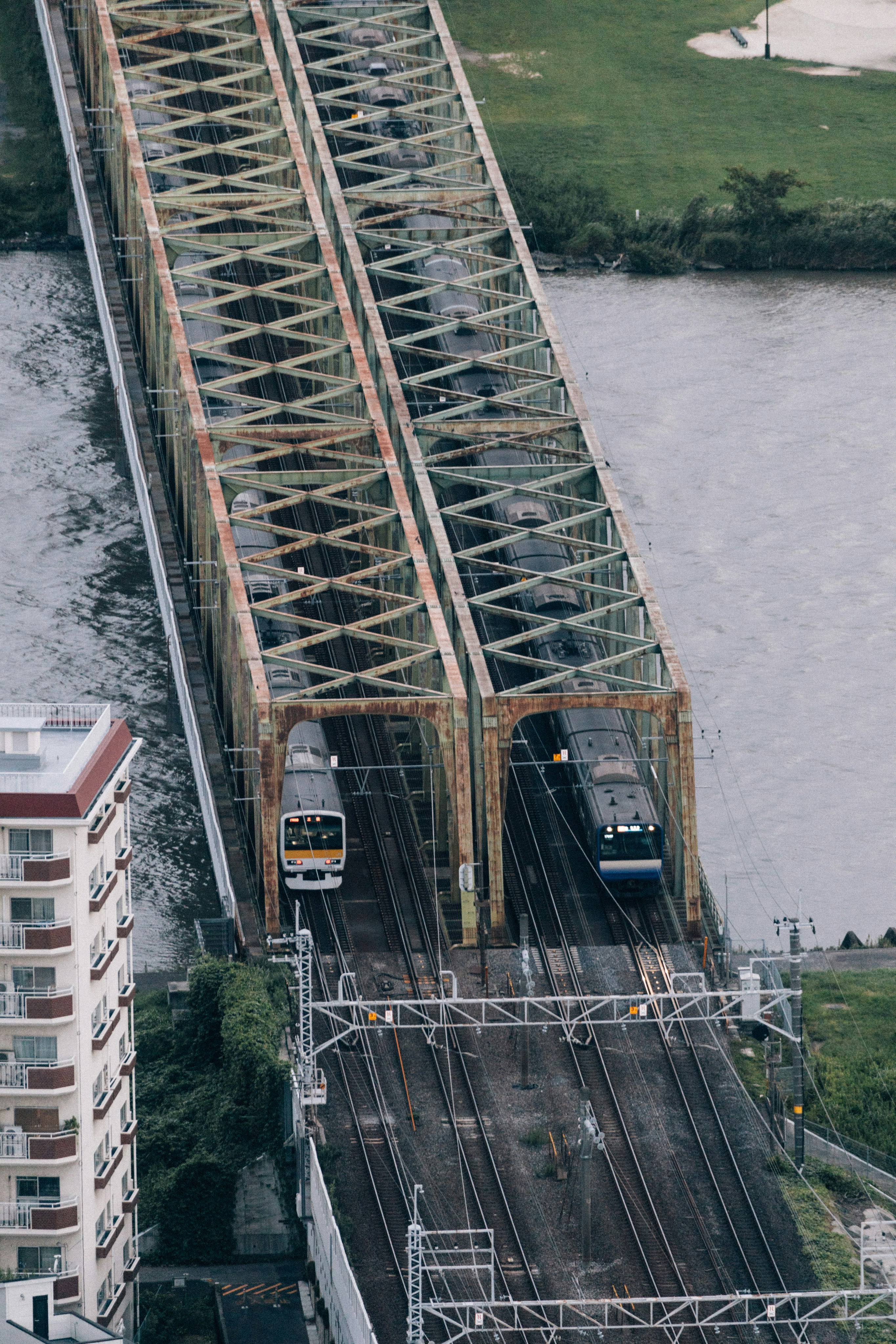 A train going over a bridge over a river photo – Free Building Image on ...