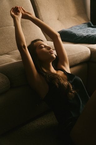 A woman sitting on a couch in a living room