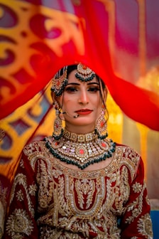 A woman in a red and gold outfit