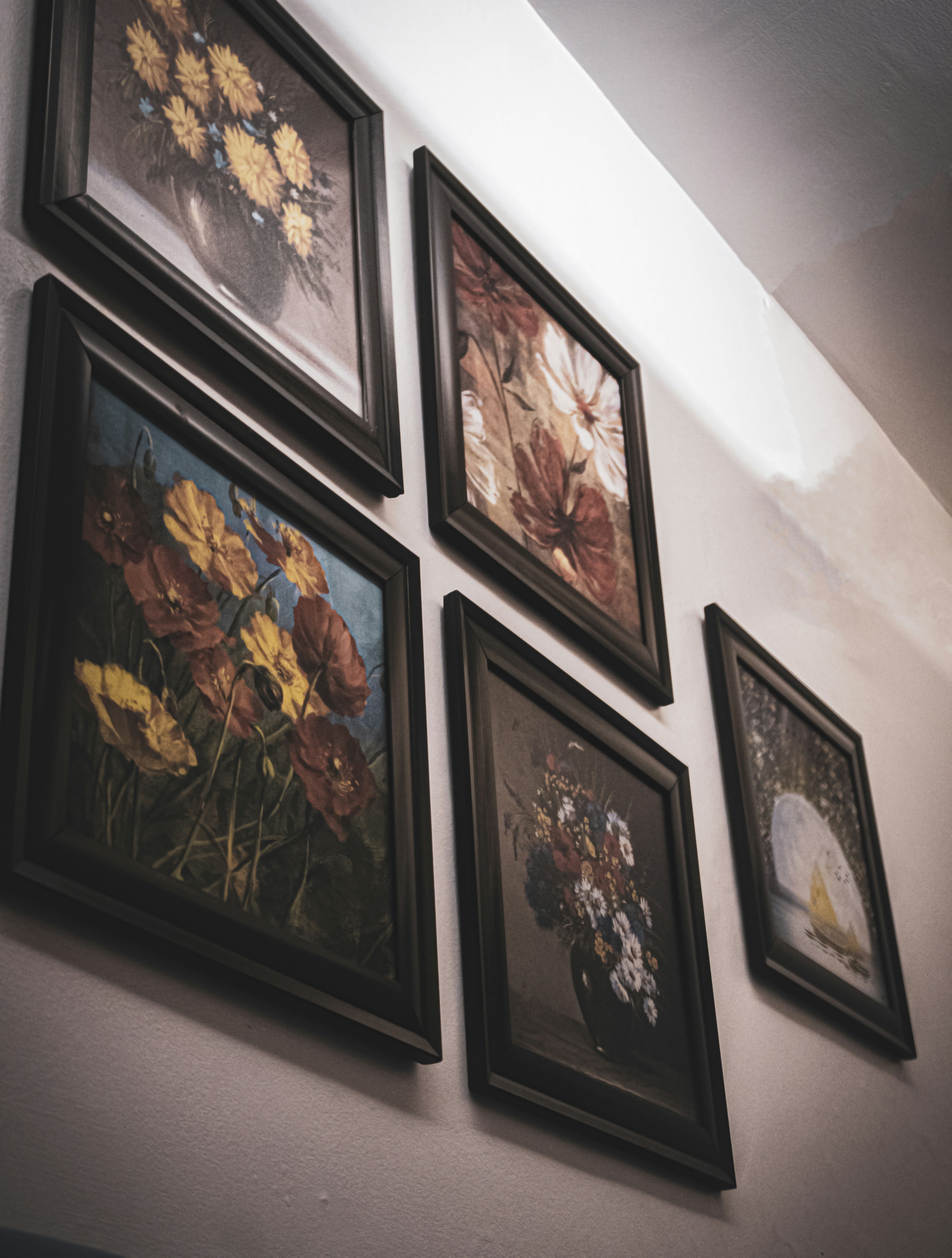 A bunch of pictures hanging up on a wall