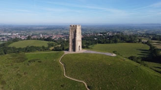 An aerial view of a tower on a hill