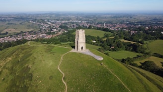 An aerial view of a tower on a hill
