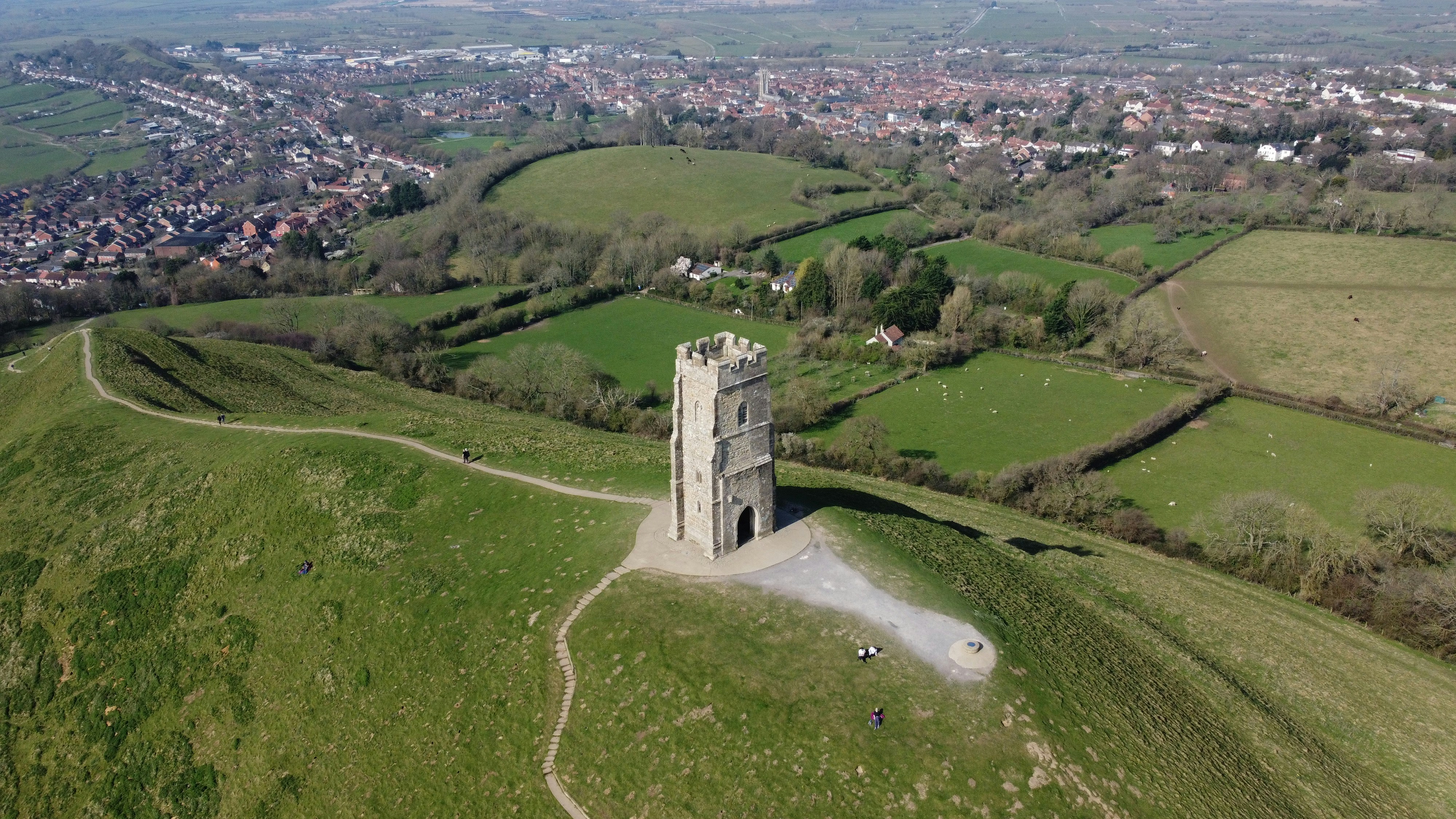 An aerial view of a tower on a hill