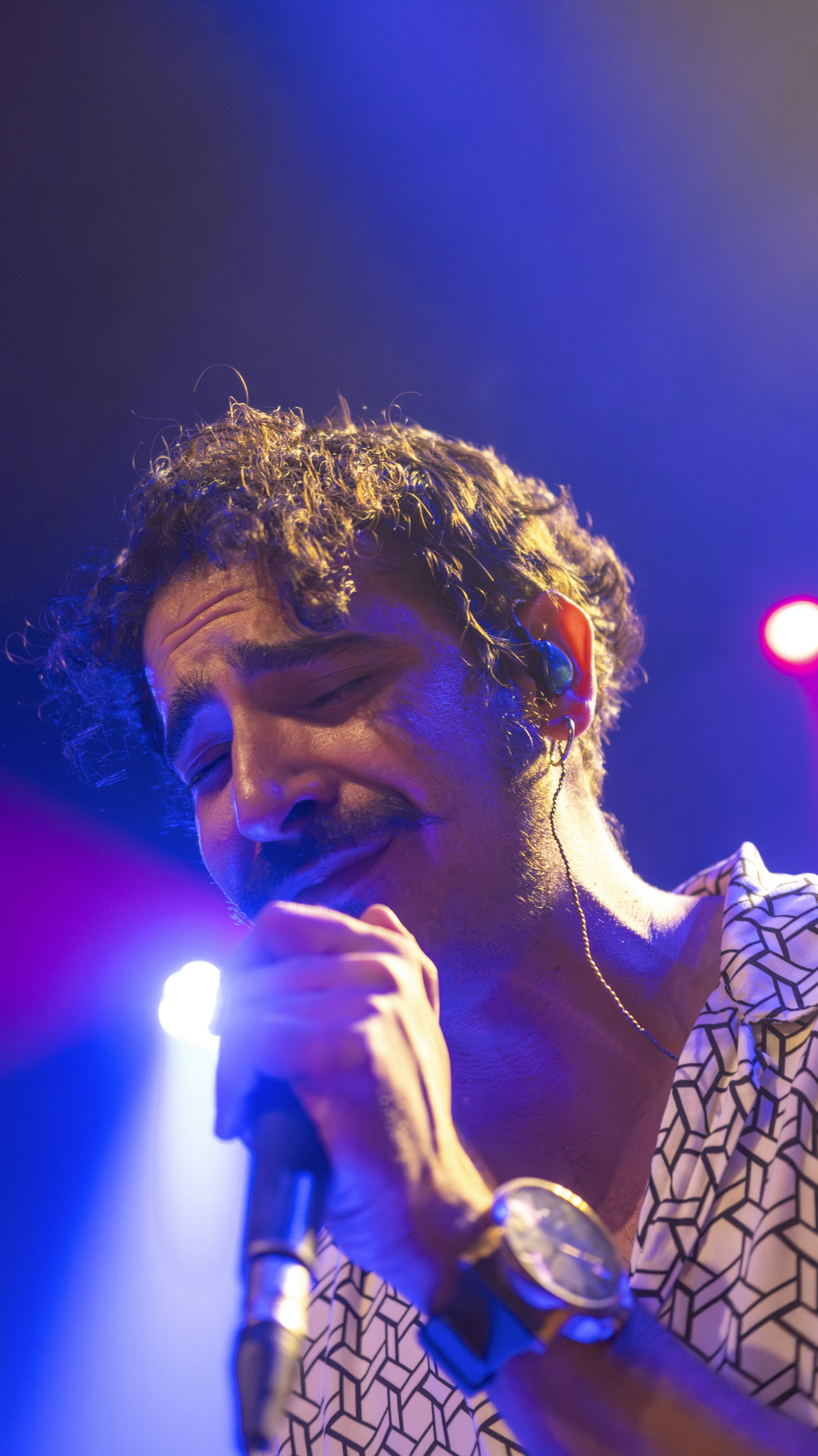 A man holding a microphone up to his face