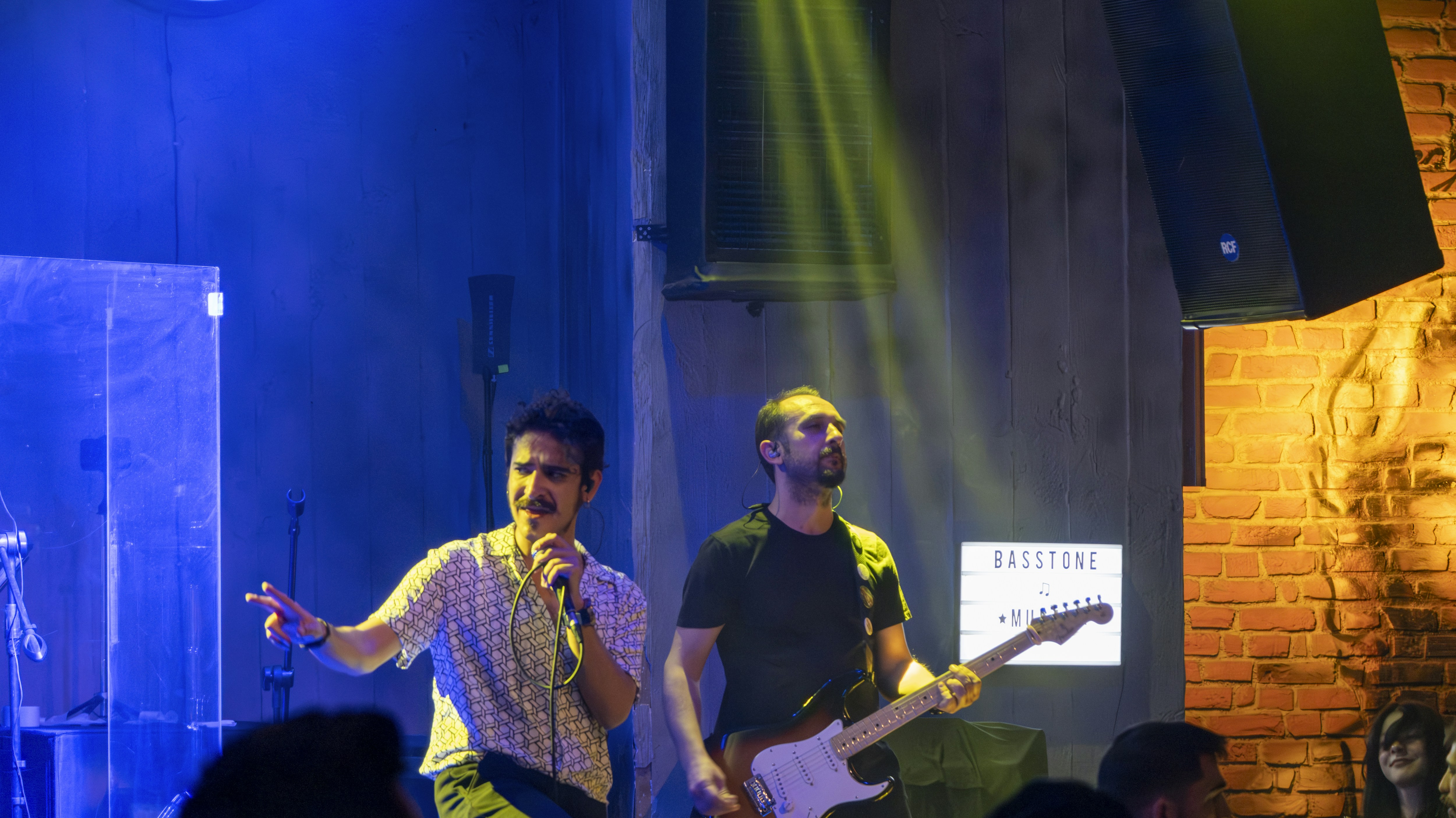 A group of men standing on top of a stage
