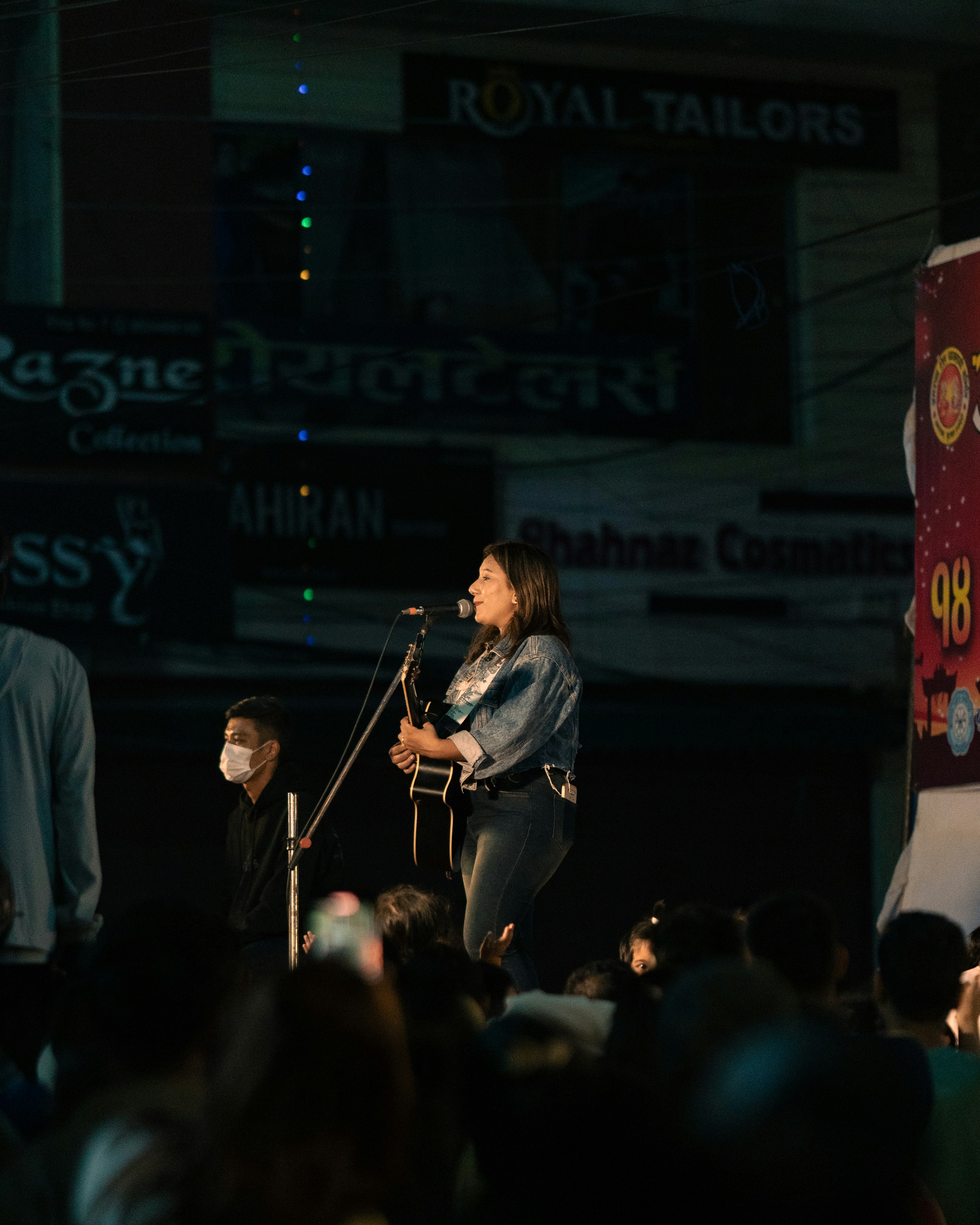 A group of people standing on top of a stage