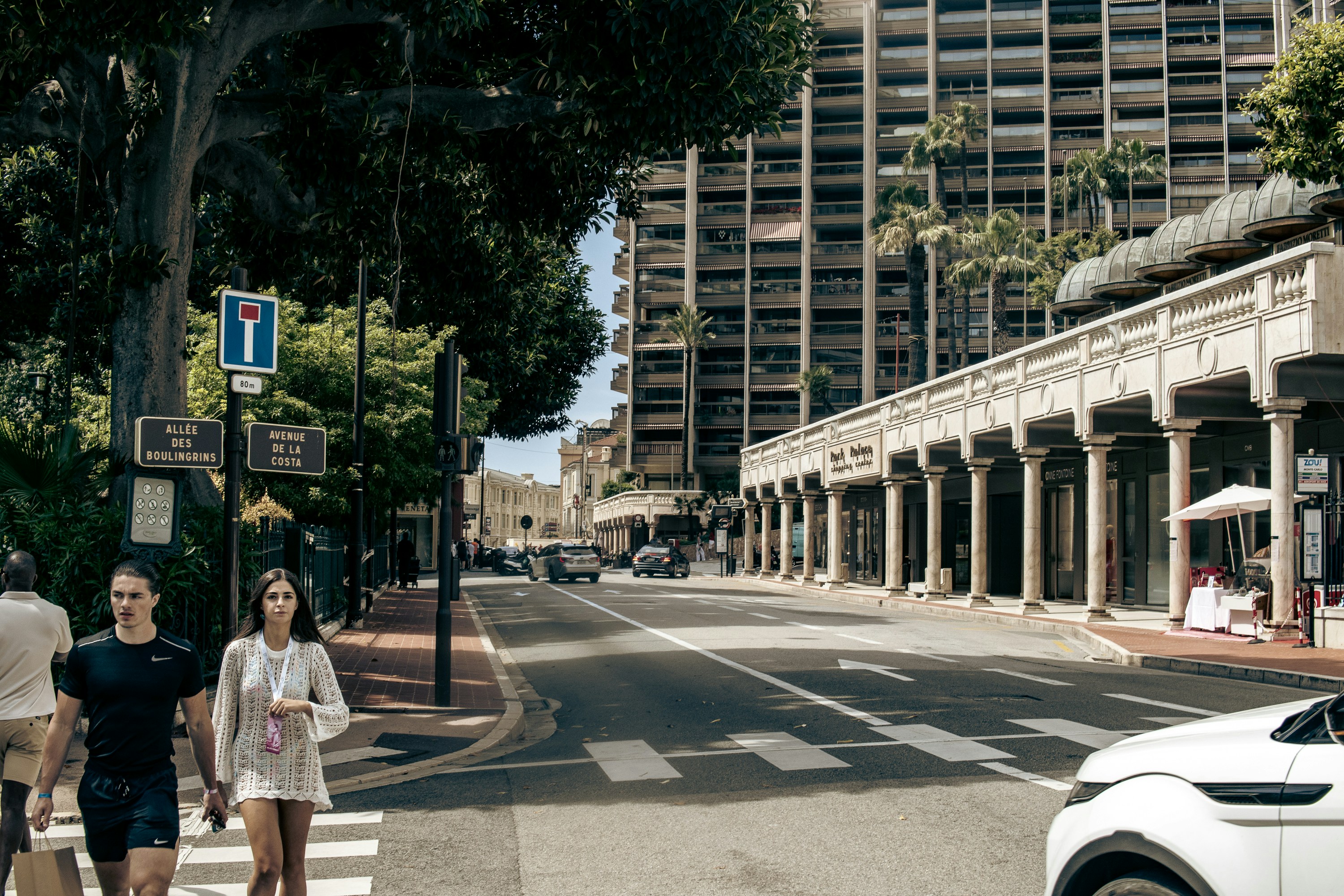 A group of people walking across a cross walk