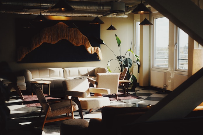 A living room filled with furniture next to a window