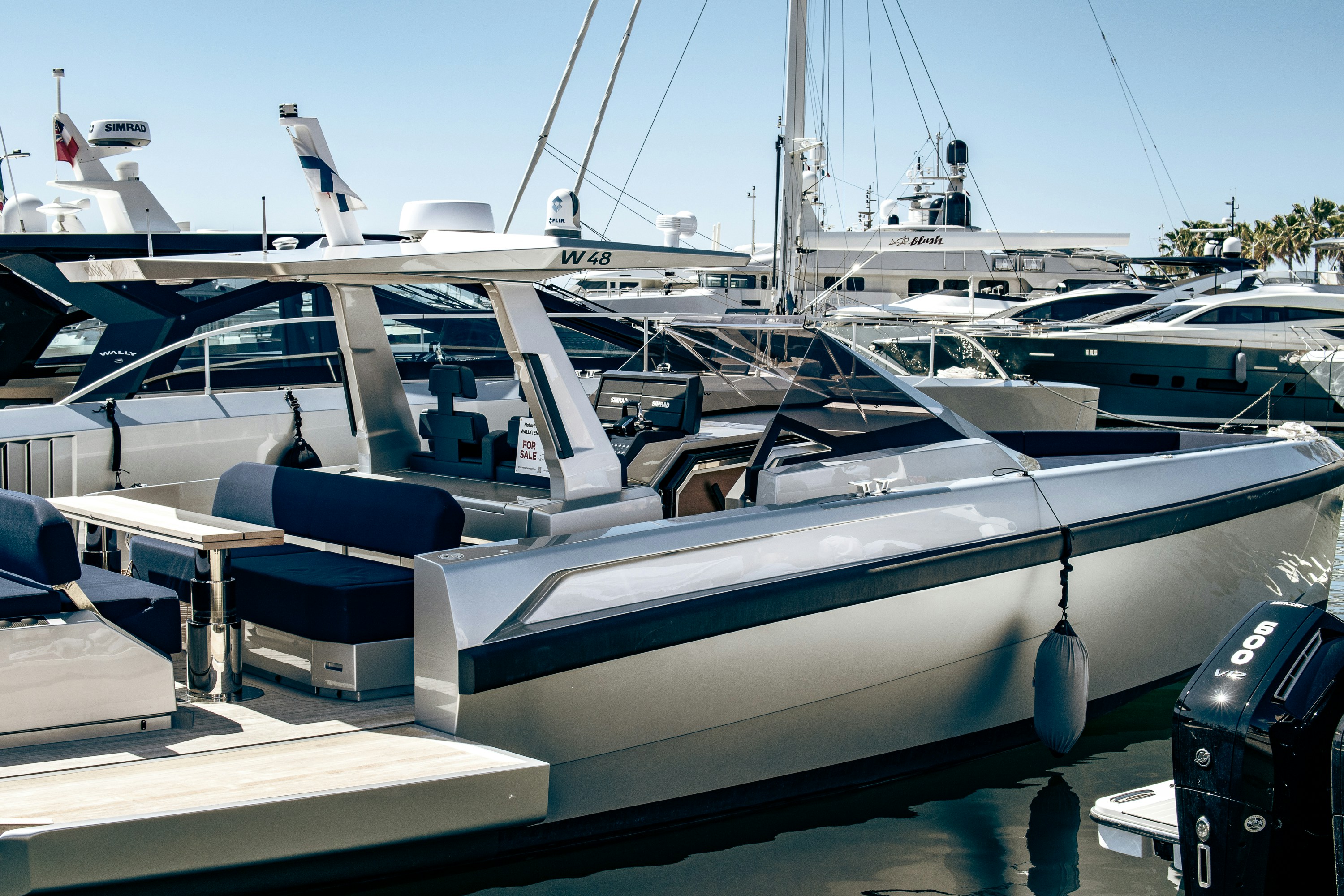 A group of boats docked at a marina