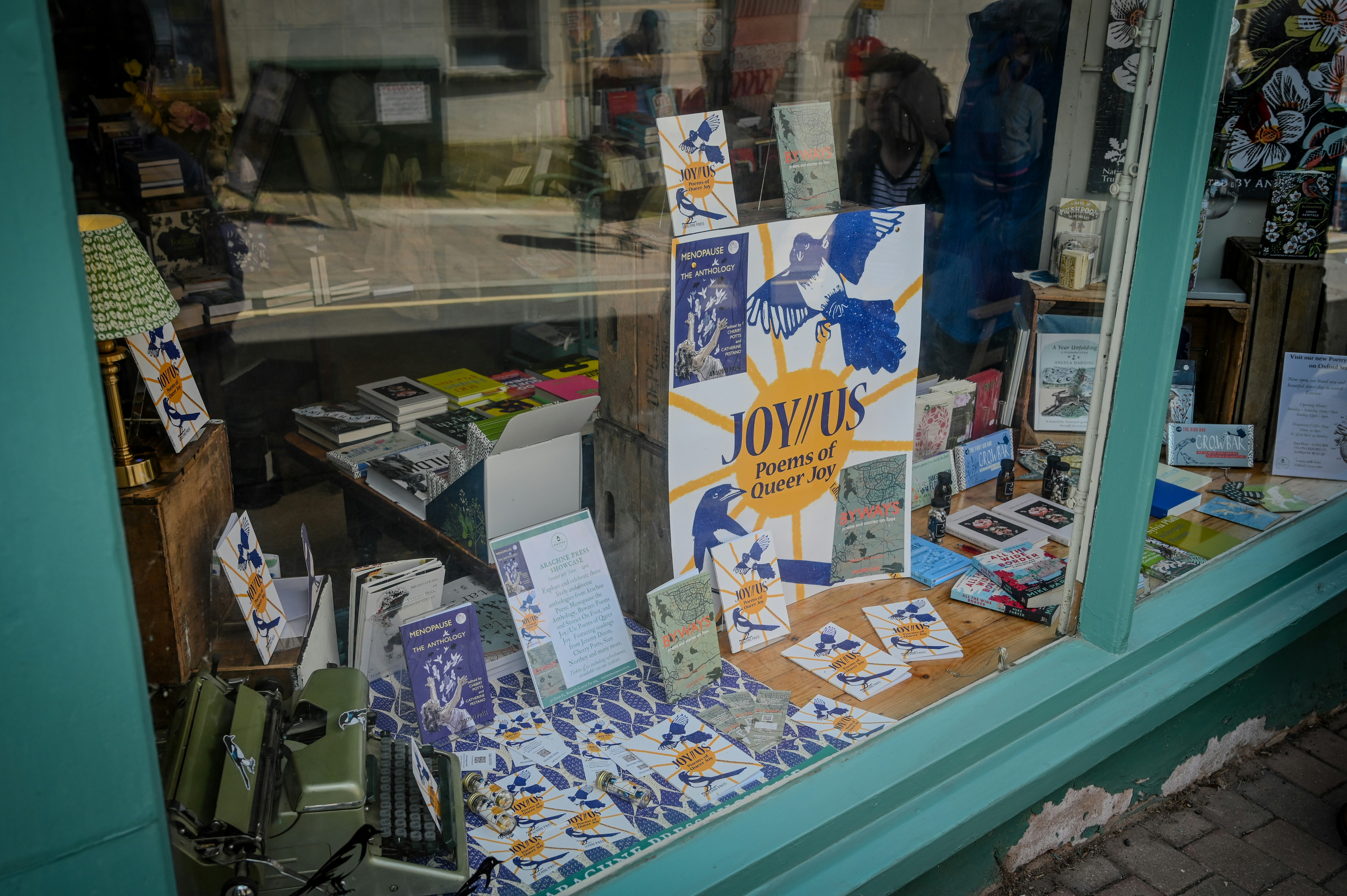 A store front window with a lot of cards on it