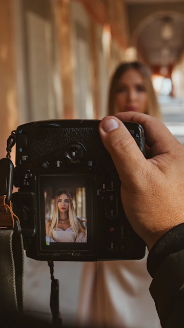 A woman taking a picture of herself on a camera