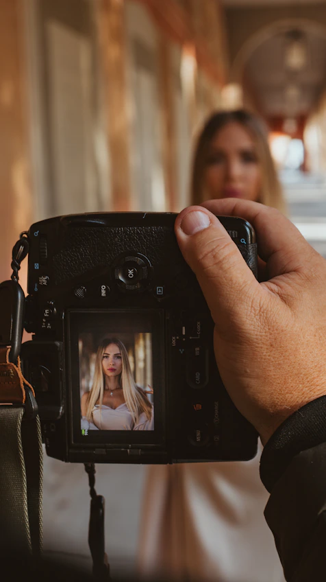 A woman taking a picture of herself on a camera