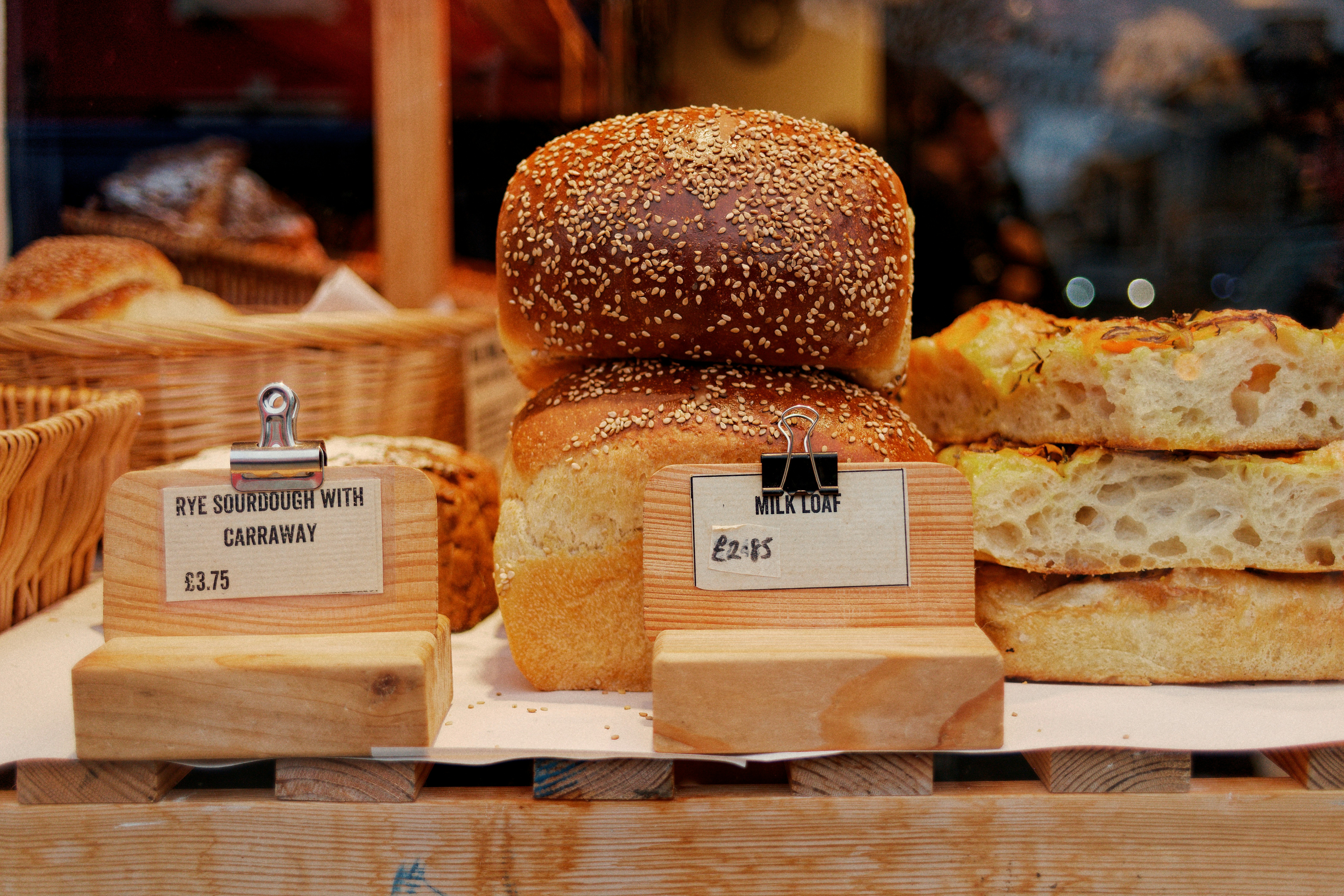 A bunch of different types of bread on display