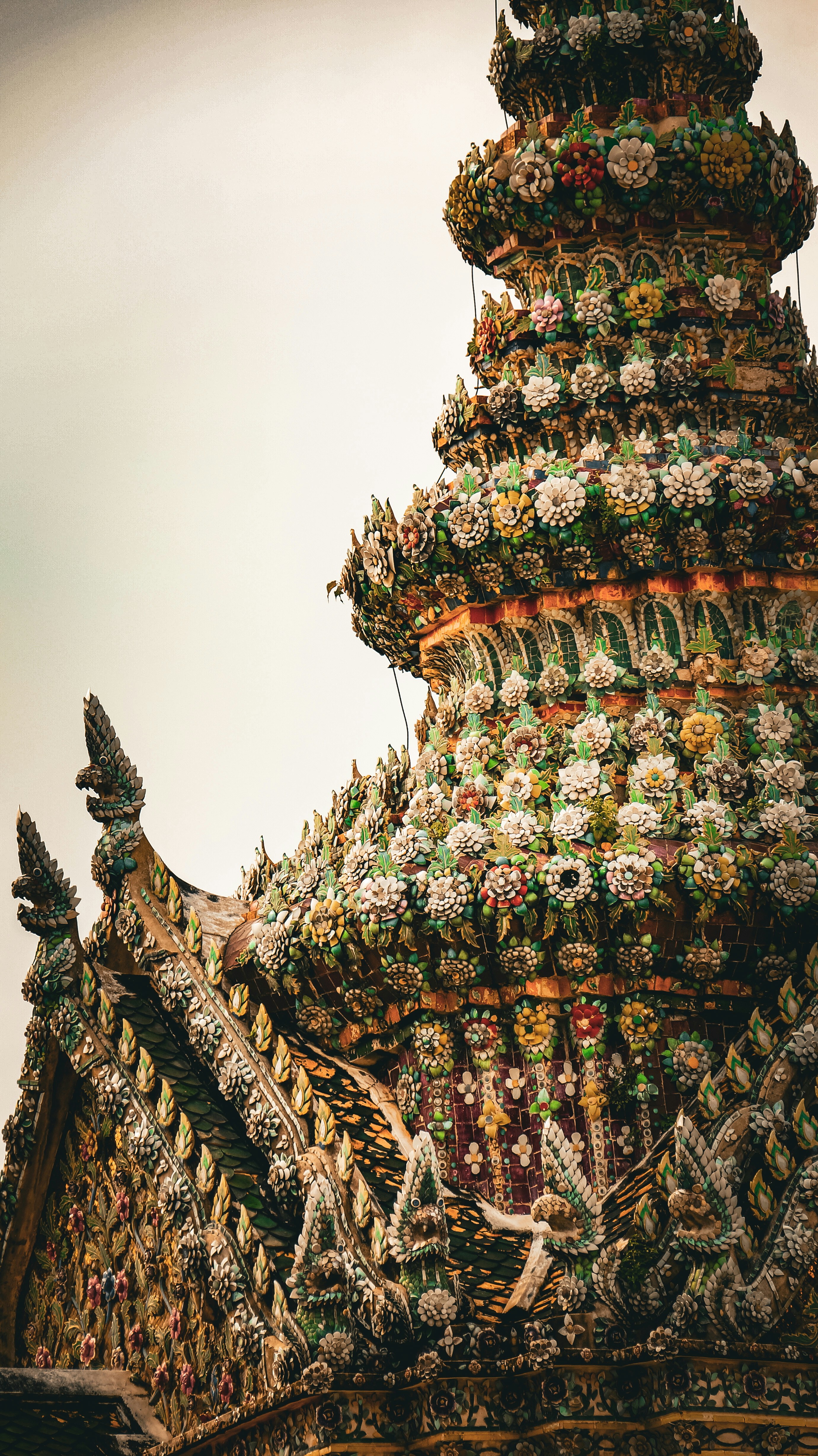 A very tall building with a lot of decorations on top of it