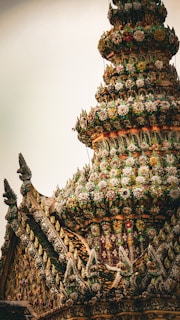 A very tall building with a lot of decorations on top of it