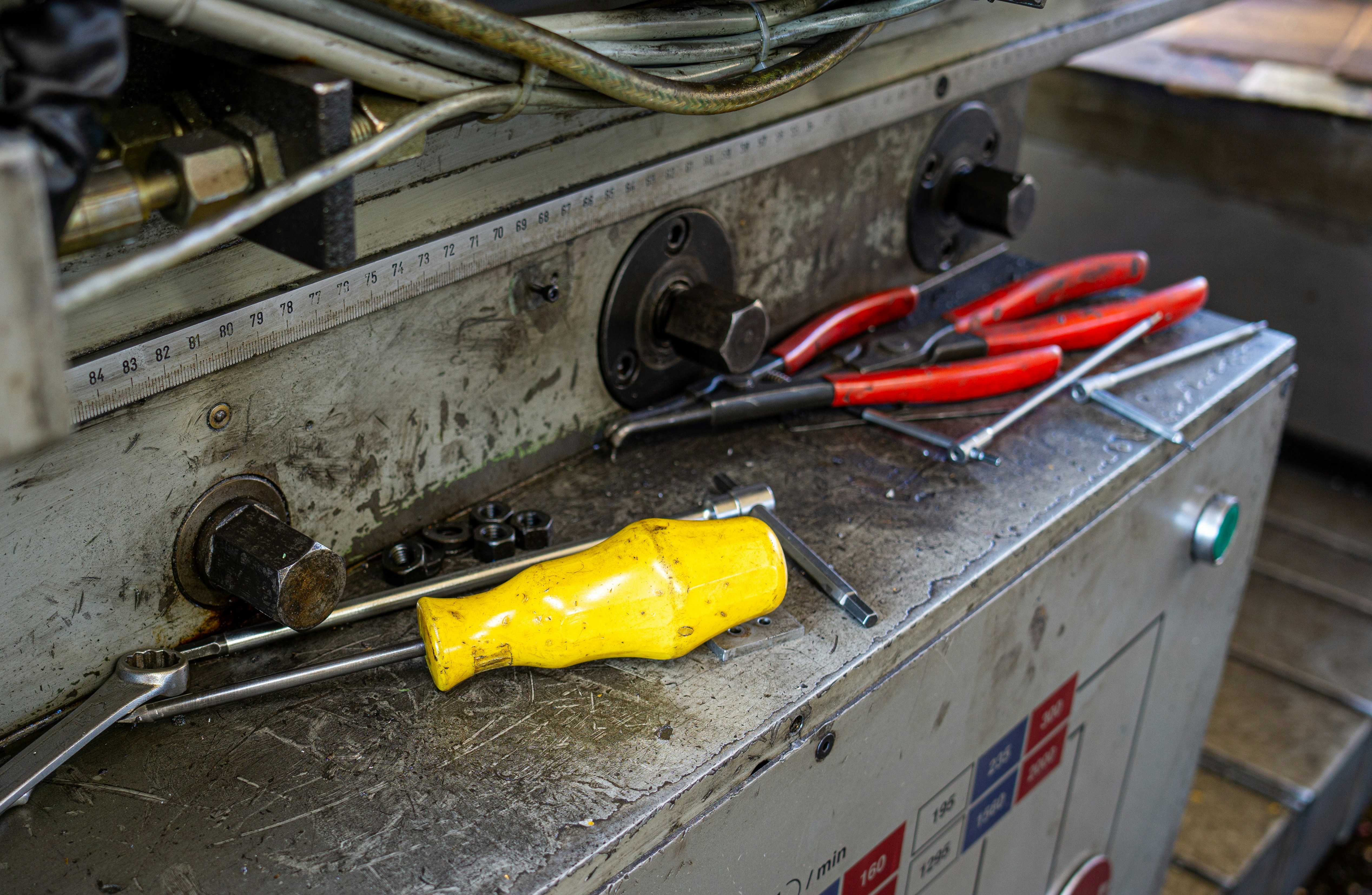 Assorted hardware supplies including screws and metal brackets on a workbench
