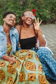 A couple of women sitting next to each other