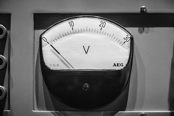 A black and white photo of an analog clock