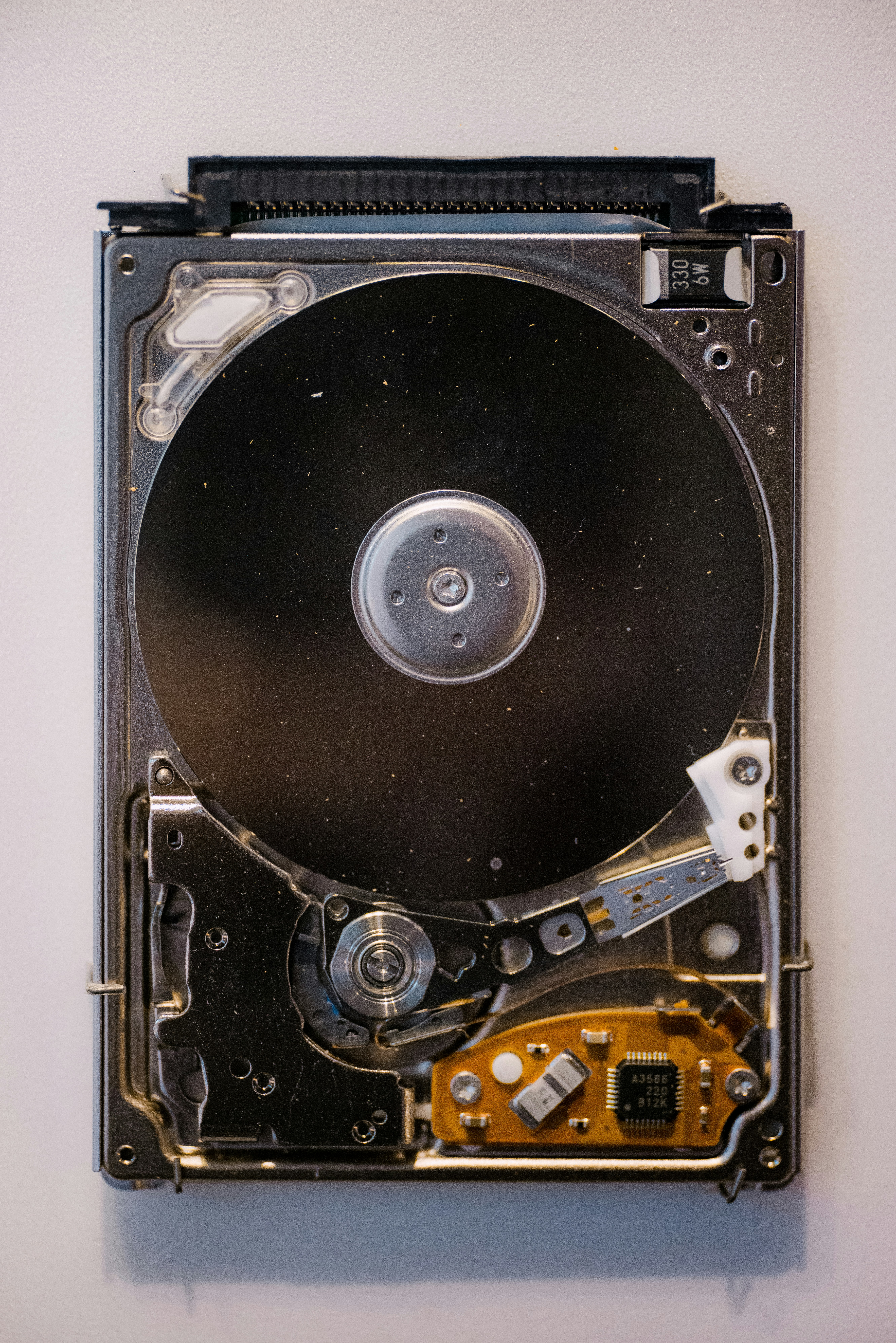A close up of a hard drive attached to a wall