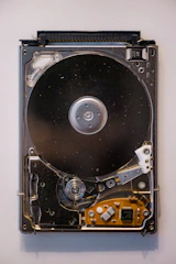 A close up of a hard drive attached to a wall
