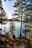 A person walking on a trail near a lake