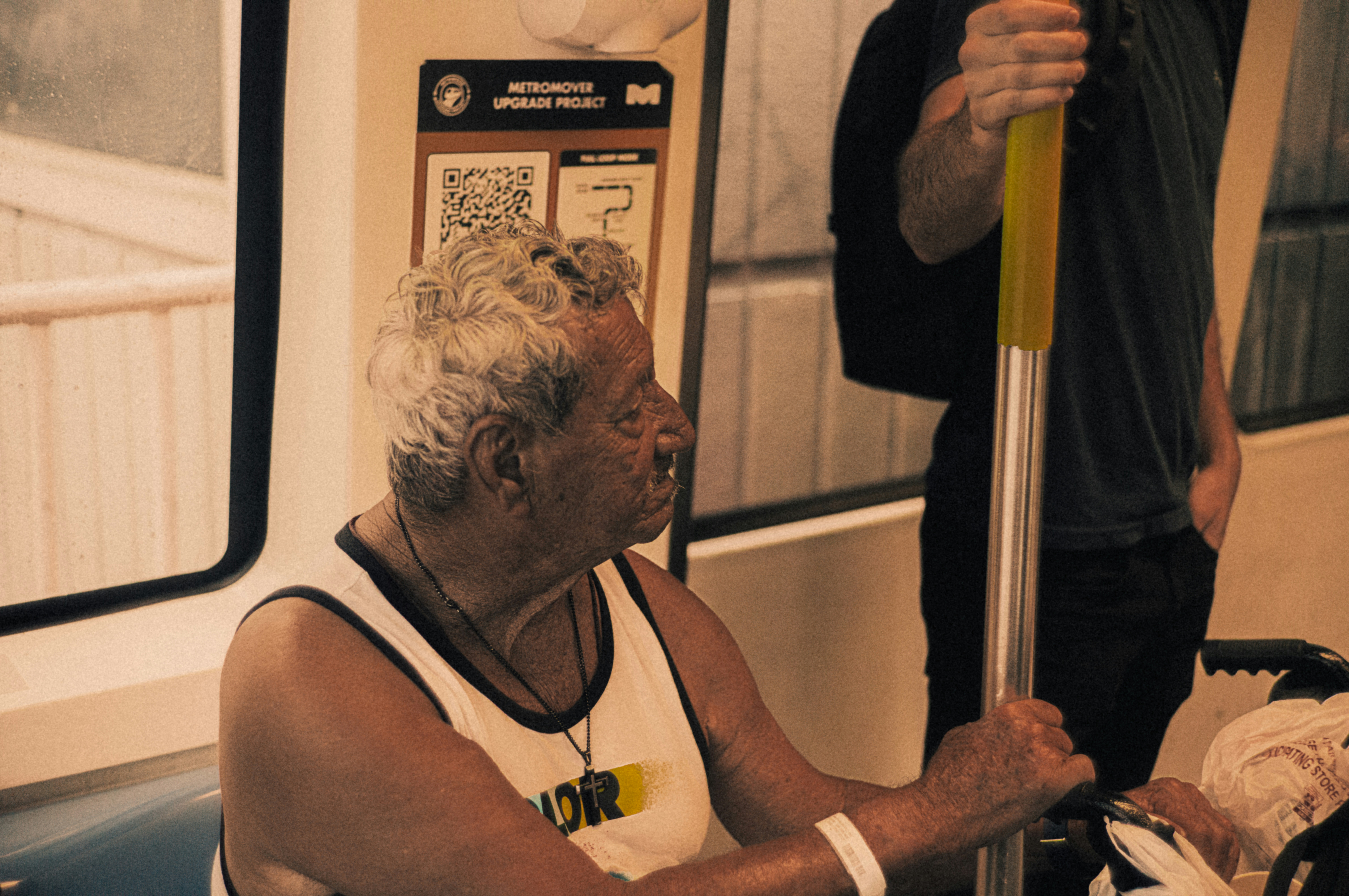 A man and a woman sitting on a train