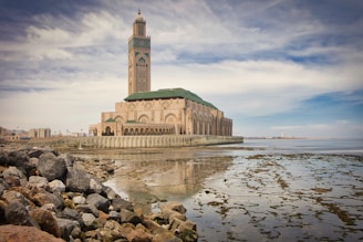 A large building sitting on top of a body of water