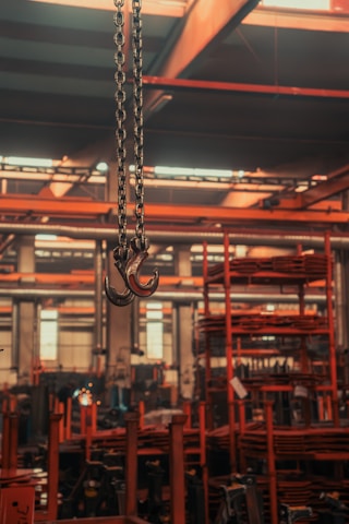 A large metal object hanging from a chain