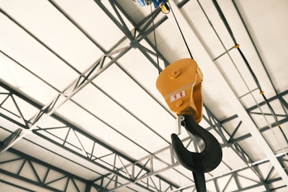 A crane hanging from the ceiling of a building