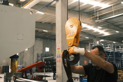 A man working on a machine in a factory