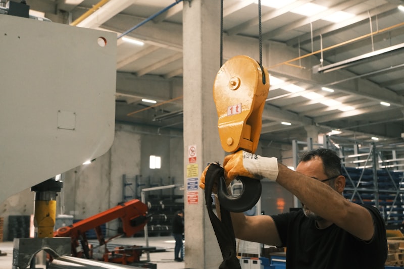 A man working on a machine in a factory