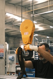 A man working on a machine in a factory