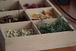 A wooden box filled with different types of food