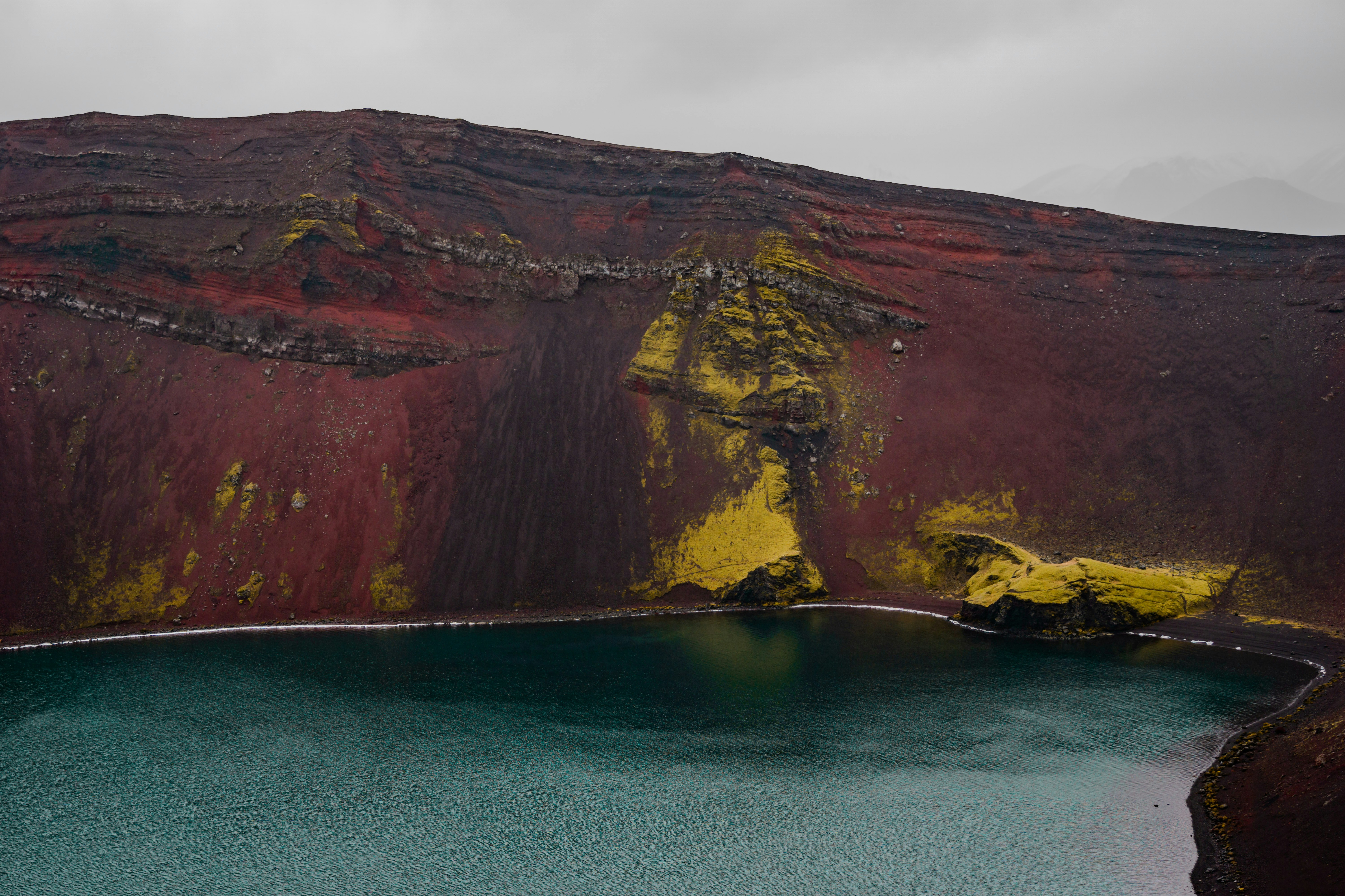 A large body of water near a mountain