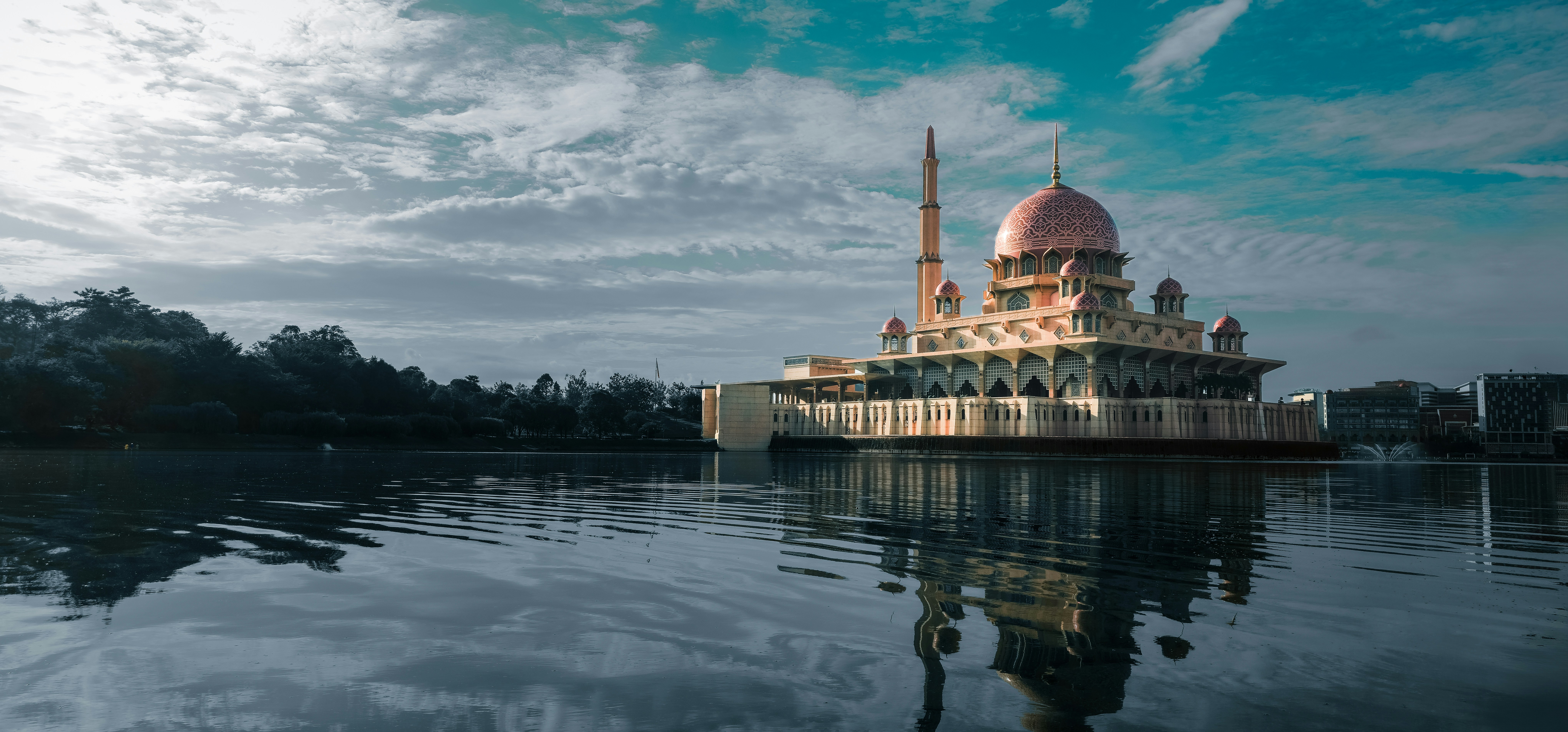 A large building sitting on top of a lake