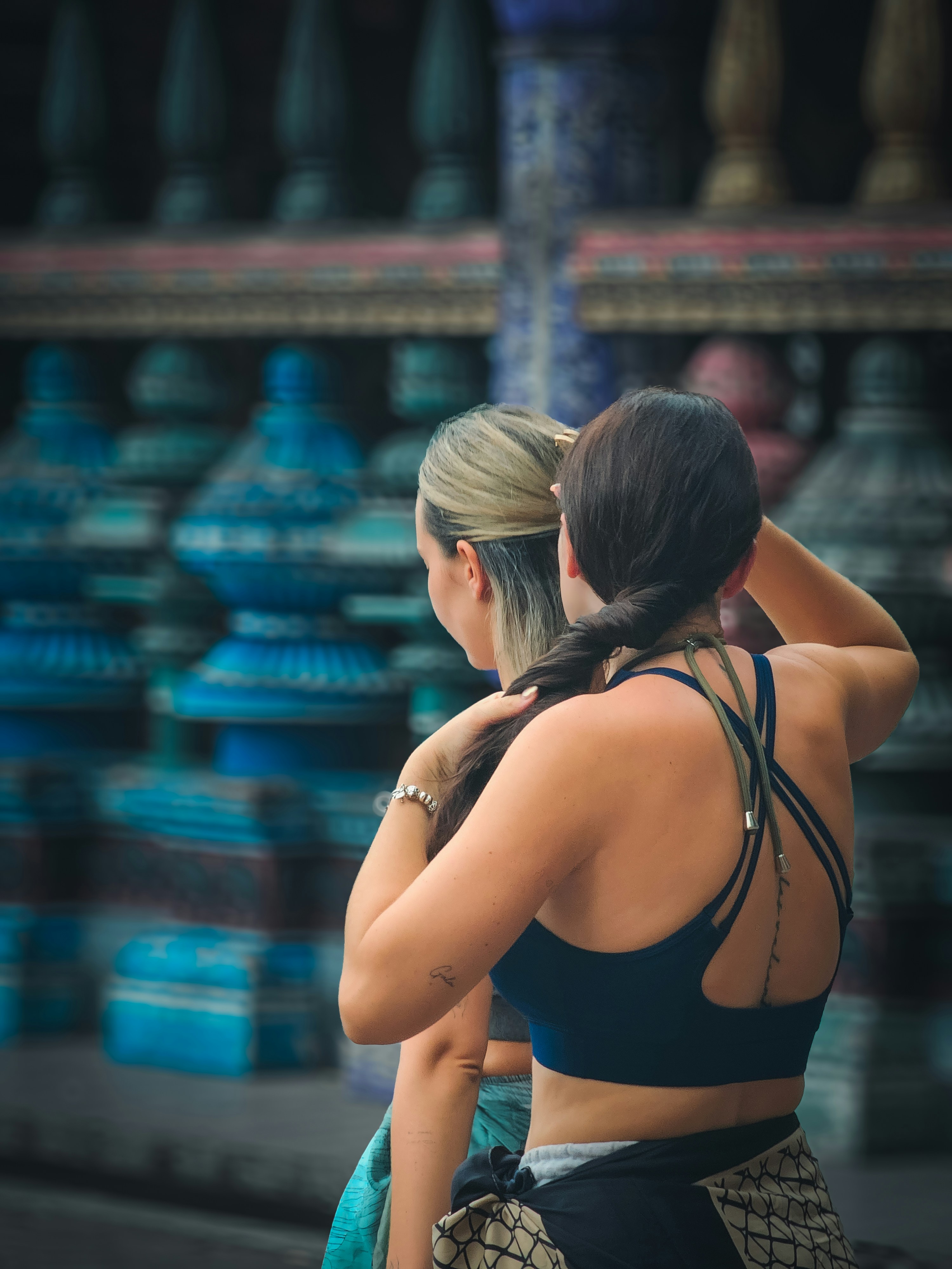 A couple of women standing next to each other