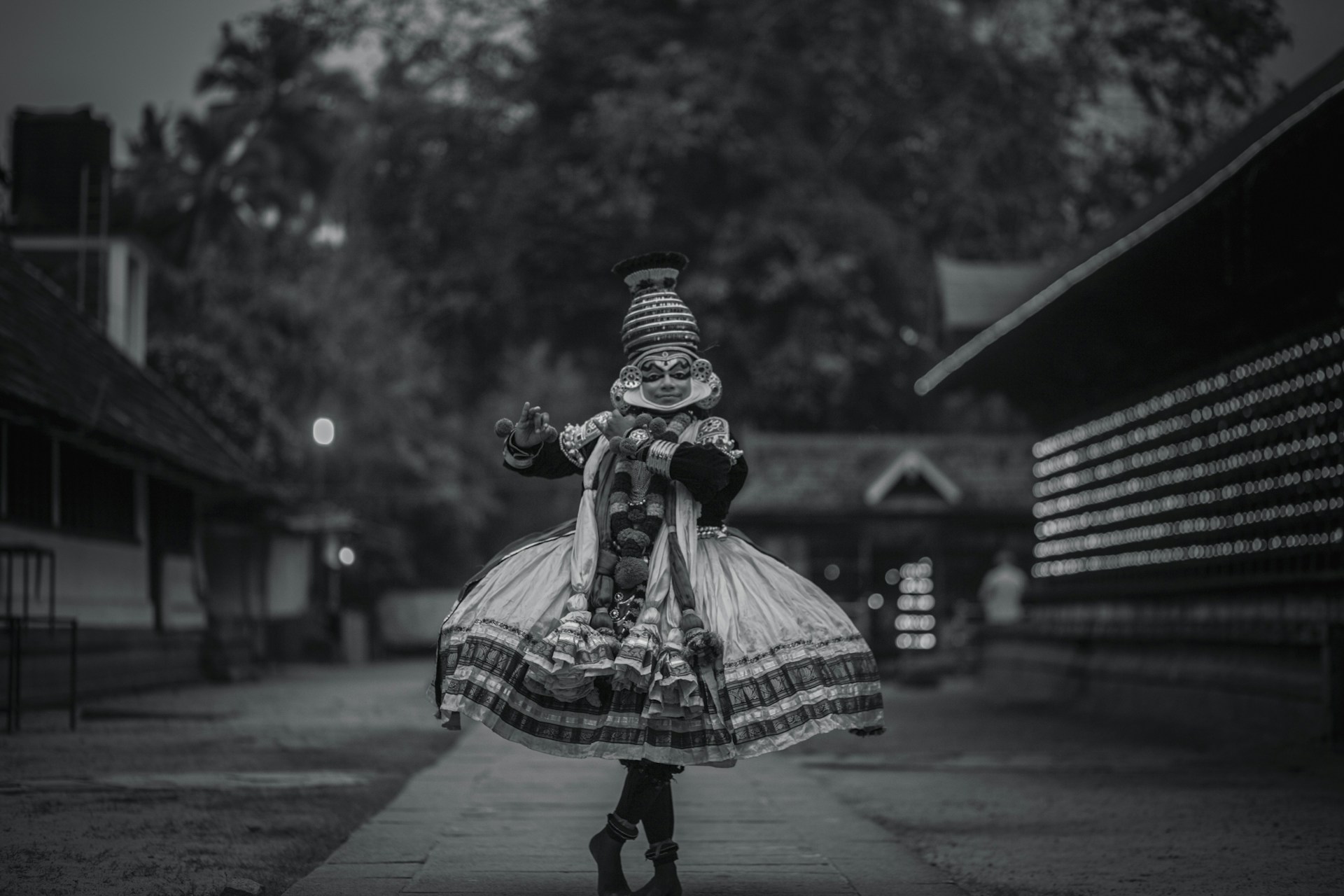 A black and white photo of a woman in a dress