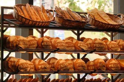 A bunch of breads that are on a rack