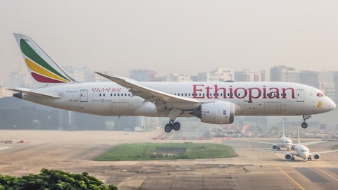 A large jetliner taking off from an airport runway