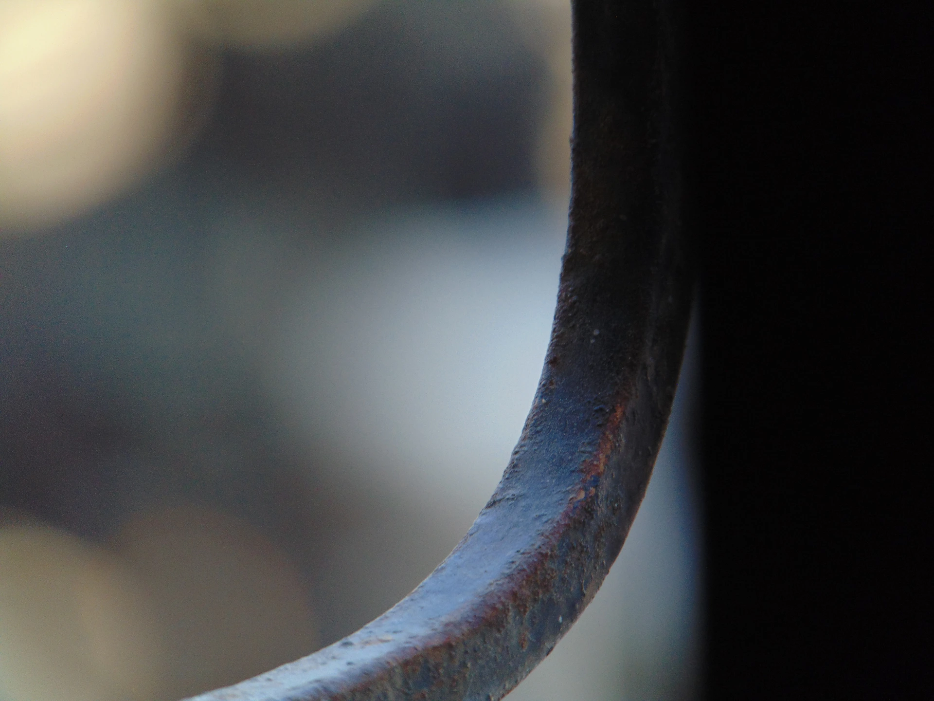 A close up of a metal object with a blurry background