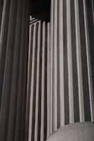 A black and white photo of a building with columns