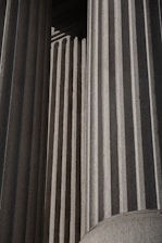A black and white photo of a building with columns