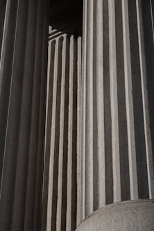 A black and white photo of a building with columns